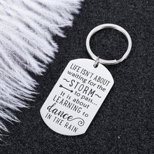 Load image into Gallery viewer, Encouragement Gifts for Daughter Son Motivational Keychain Inspirational Birthday Graduation Gift for Women Men Teenage Girls Boys Life Isn’t About Waiting The Storm Jewelry Charm